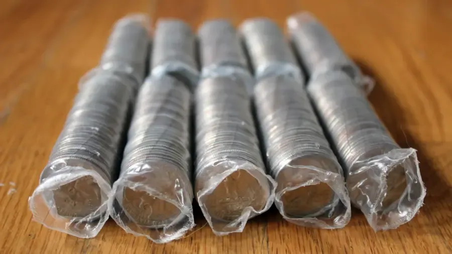 Hoeveel weegt een rol kwartjes?